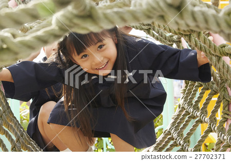 Children playing with playground equipment Children playing with playground equipment 27702371