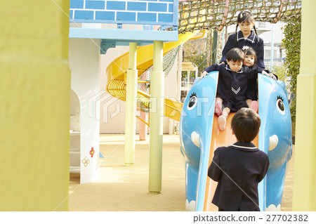 Children playing with playground equipment 27702382