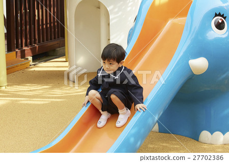 Children playing with playground equipment 27702386
