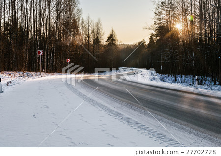 winter road in a snowy forest winter road in a snowy forest 27702728