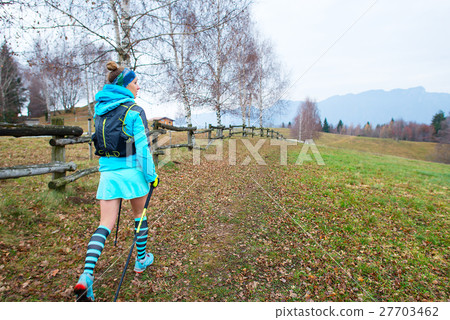 Sporty woman walking in nature Sporty woman walking in nature 27703462