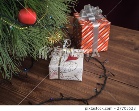 Green Christmas tree decorated with toys and 27703528