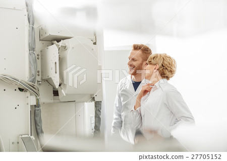 Smiling confident doctors working together 27705152