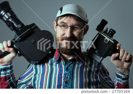 Smiling bearded man two old retro film camera 27705169