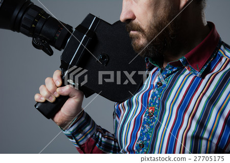 Bearded Man Movie Camera thoughtfully Bearded Man Movie Camera thoughtfully 27705175