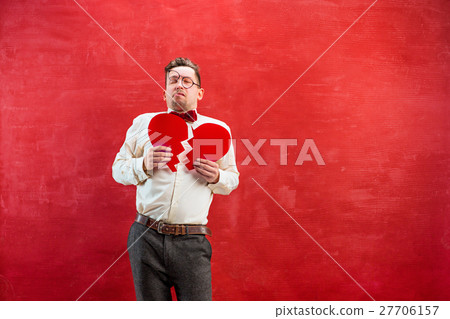 Young funny man with abstract broken heart 27706157
