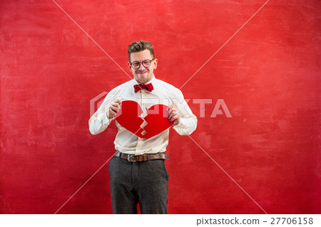 Young funny man with abstract broken heart 27706158