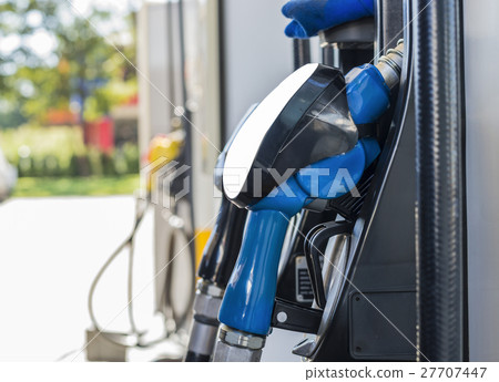 Horizontal shot of some fuel pumps at gas station. Horizontal shot of some fuel pumps at gas station. 27707447