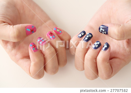 A woman who is nailing A woman who is nailing 27707582