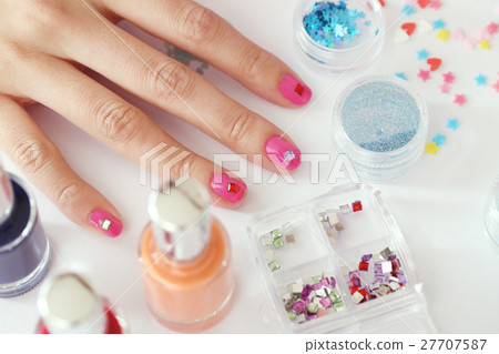 A woman who is nailing A woman who is nailing 27707587