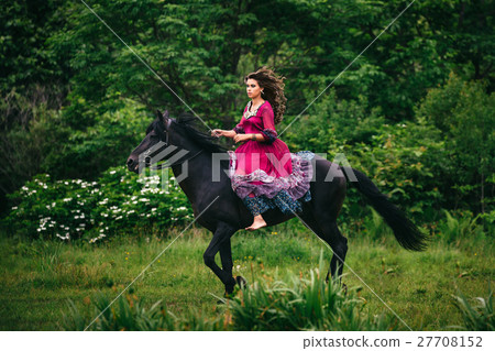 Beautiful woman on a horse 27708152