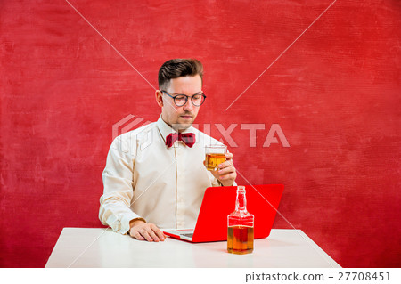 Young funny man with laptop at St. Valentine's Day 27708451