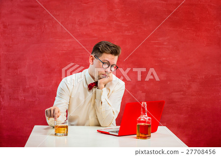 Young funny man with laptop at St. Valentine's Day 27708456