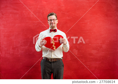 Young funny man with abstract broken heart 27708614