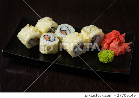 Rolls on a black plate 27709149