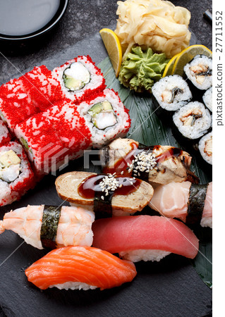 Sushi set on a stone plate and concrete background 27711552