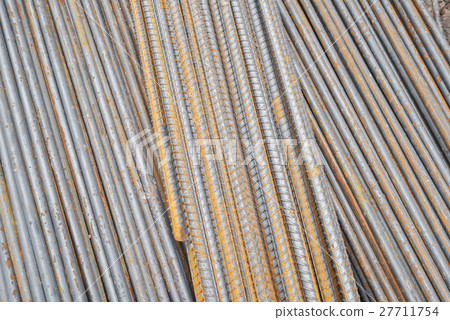 Stack of rusty round steel bar 27711754