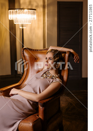 Young woman in long silk dress 27711865