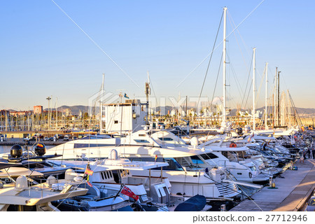 Boats at the Pier in Barcelona, Spain. Warm Sunset Boats at the Pier in Barcelona, Spain. Warm Sunset 27712946