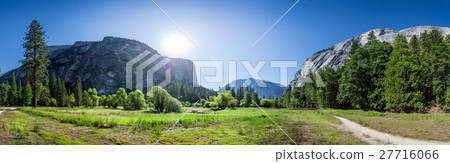 Meadow and trees surrounded by rocky mountains Meadow and trees surrounded by rocky mountains 27716066