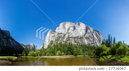Clear water and evergreen pine forest 27716067