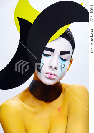 Yellow paint bodyart. Young girl. Yellow paint bodyart. Young girl. 27716591