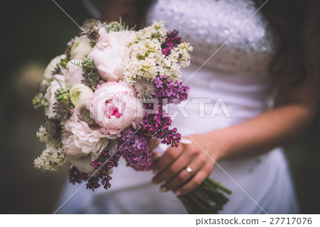 pink and purple wedding bouquet in bride hands pink and purple wedding bouquet in bride hands 27717076