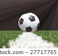 Soccer ball on the green field 27717765