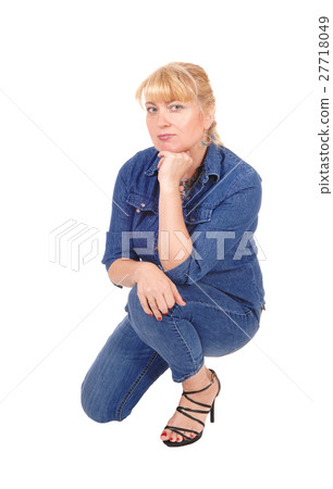 Woman kneeling on floor. Woman kneeling on floor. 27718049
