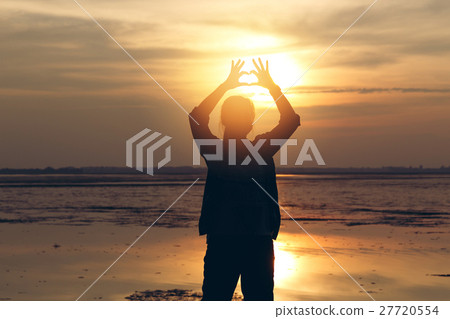 Silhouette woman lifestyle relax at sunset  27720554