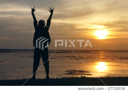 Silhouette woman lifestyle relax at sunset Silhouette woman lifestyle relax at sunset 27720558