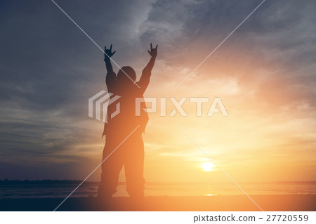 Silhouette woman lifestyle relax at sunset  27720559