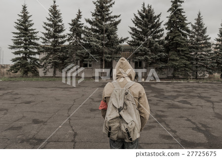 boy goes to an abandoned building.  27725675