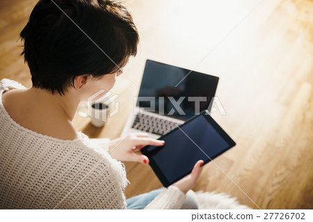 top view of a woman with a tablet top view of a woman with a tablet 27726702