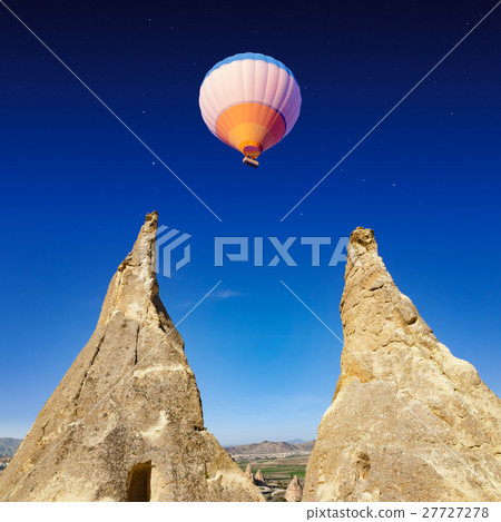 Hot air balloon flies in Cappadocia, Turkey 27727278
