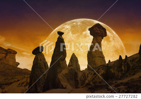 Rising moon, silhouettes of rocks in Cappadocia 27727282