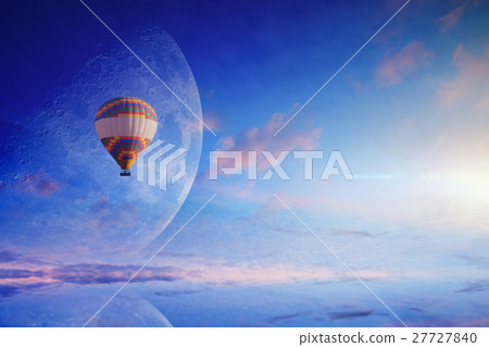 Hot air balloon in blue sky with rising full moon Hot air balloon in blue sky with rising full moon 27727840