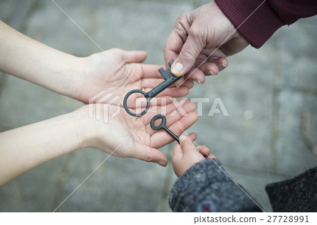 Three generations hand hand over key 27728991