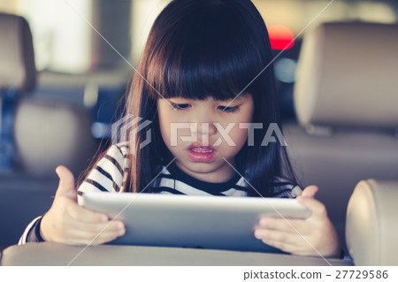 kid play Tablet in car 27729586