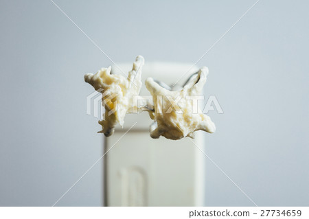 Electronic beater stained with cream 27734659