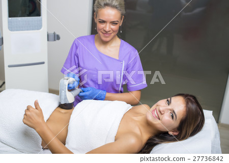 beauty treatment of a woman in specialized clinic beauty treatment of a woman in specialized clinic 27736842
