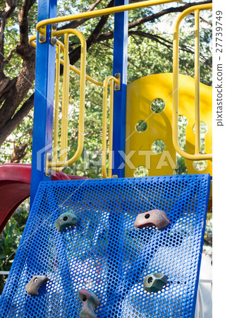 Artificial rock climbing wall at playground Artificial rock climbing wall at playground 27739749