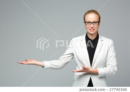 Business woman showing hand sign to side. Business woman showing hand sign to side. 27740300