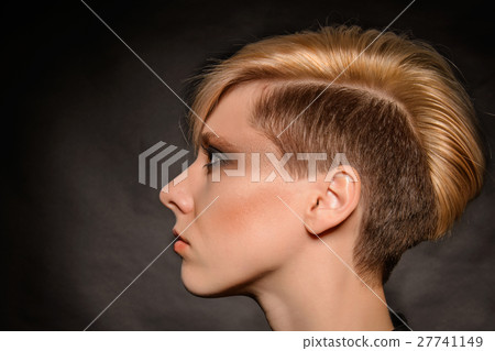 girl with a short stylish haircut on a dark back 27741149