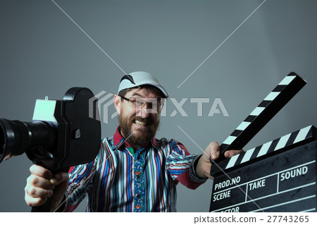 Screaming man retro movie camera and clapperboard Screaming man retro movie camera and clapperboard 27743265