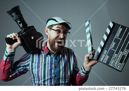 Screaming male retro movie camera and clapperboard Screaming male retro movie camera and clapperboard 27743276