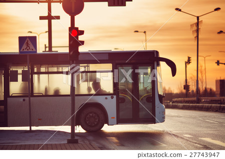 Bus moving on the road in city in early morning 27743947