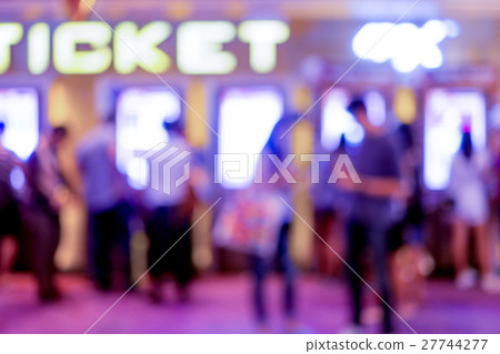 Abstract blur people buying movie ticket 27744277