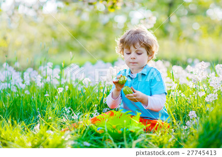 little kid boy having fun with traditional Easter little kid boy having fun with traditional Easter 27745413