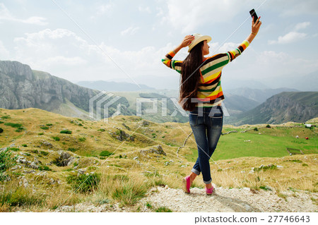 selfie photo long hair girl taking on smartphone  27746643
